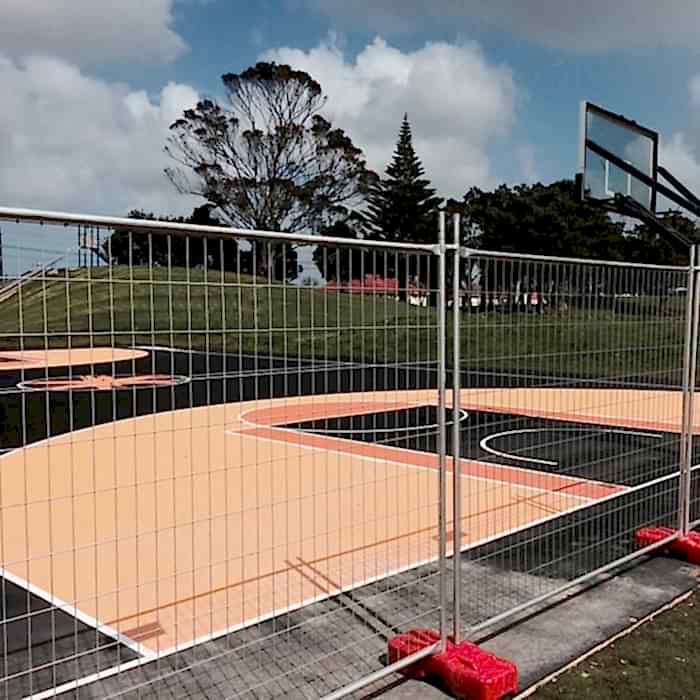 Australia temporary fence is used to create boundaries for basketball court.