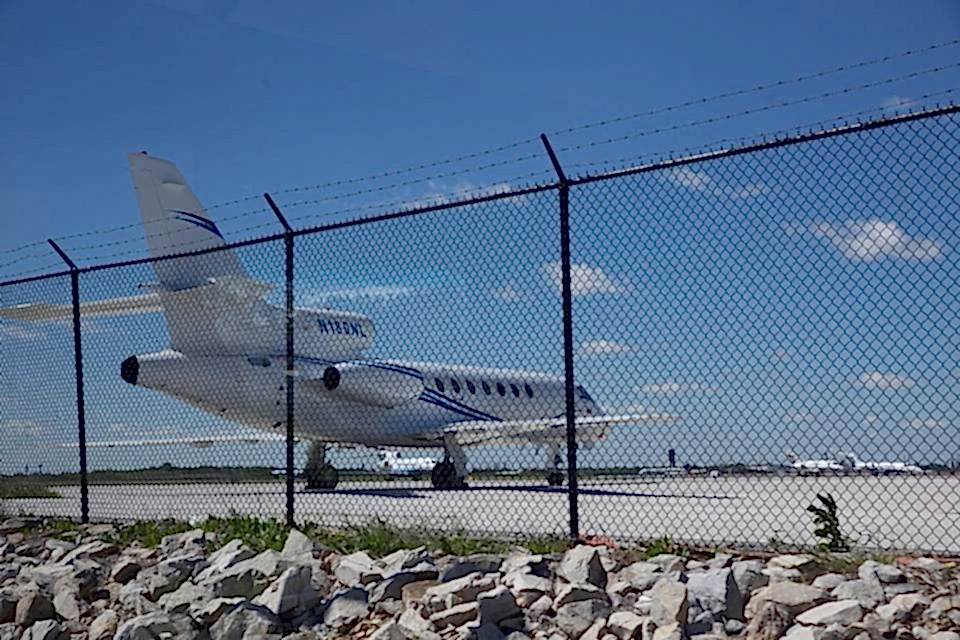 Chain link fences are installed at the airside of airport with barbed wire on the topping.