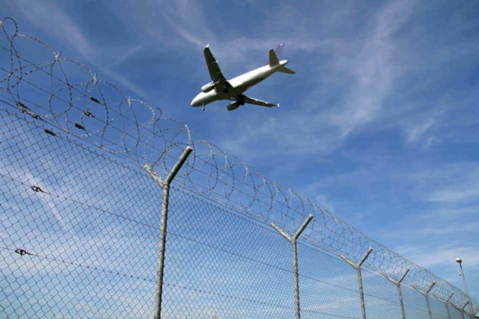 Chain link fences are installed at the airside of airport with concertina wire on the topping.