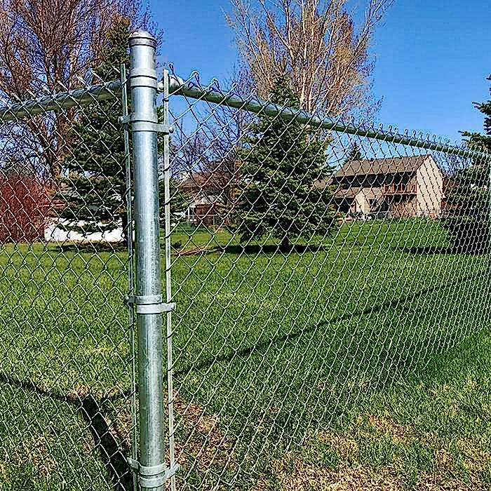 The chain link fence is used to set boundaries for gardens.