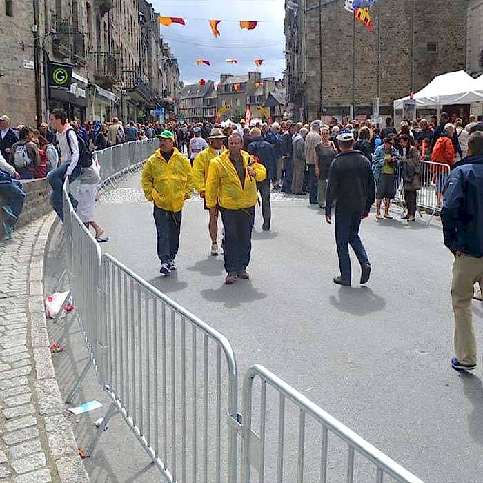 Crowd control barrier is set along the street.