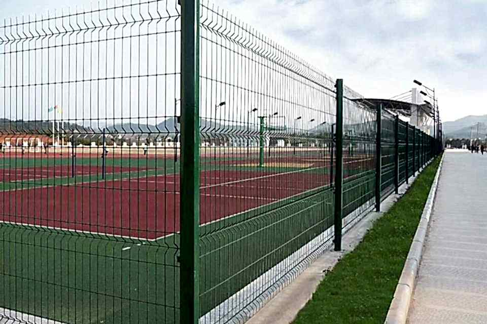 Curvy welded fence is installed along the running race.