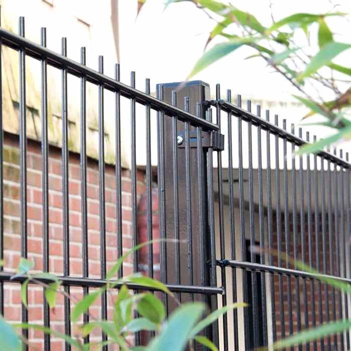 Black double wire fence is installed outside the building.