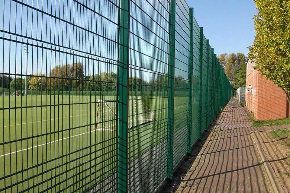 Double wire fence is installed round the football field.