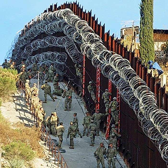 Concertina razor wires are installed on the country boundary.