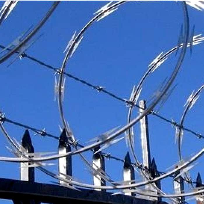 Concertina razor wires are installed at the top of steel fence