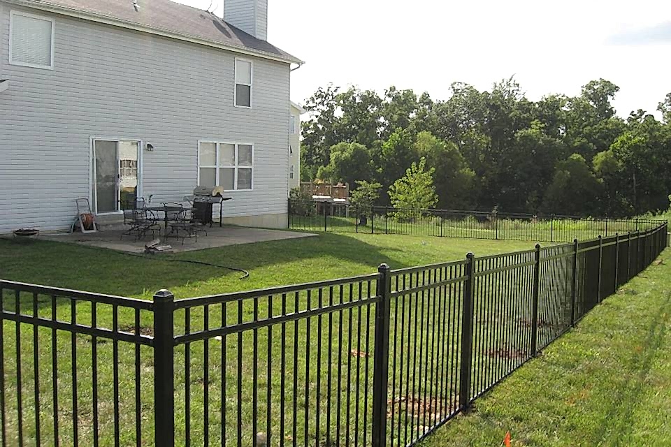 Steel fence is placed along the house yard.