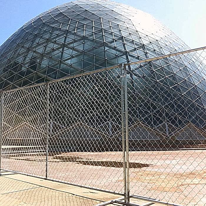 Temporary chain link fence is used to create a temporary boundary for shopping mall.