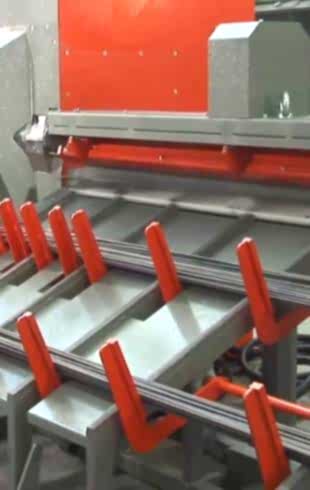 A cutting machine is straightening and cutting steel wires